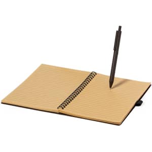 A brown notebook with lined pages, featuring a spiral binding and a black pen resting on the pages.