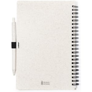 A white spiral-bound notebook made from wheat straw, accompanied by a matching pen. Contains a branding logo.