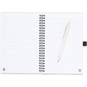A spiral-bound notebook with white lined pages and a pen resting on the left side. It features a subtle logo design.