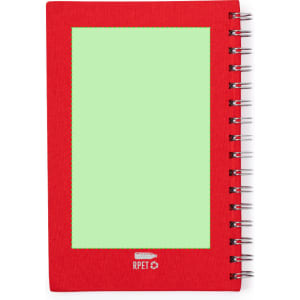 A red spiral-bound notepad featuring a green blank space on the front cover and a logo at the bottom.