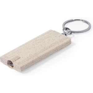 A beige torch keyring with a silver keyring attachment, featuring a small light at one end.