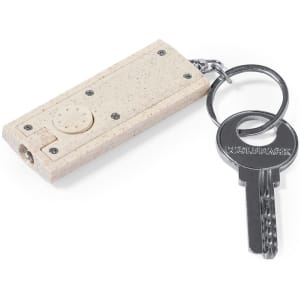 A light beige torch keyring with a key attachment, featuring a button and a compact design.