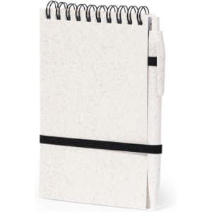 A white spiral-bound notebook with a black elastic band and a pen attached. It has a textured cover and a logo.