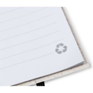 A white notebook with lined pages and a recycling logo at the corner, featuring a speckled cover.