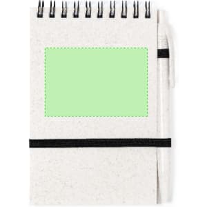 A spiral-bound, cream-coloured notebook with a green blank area on the front and an elastic band for closure.