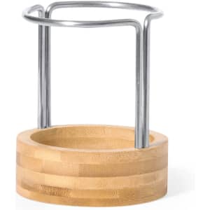 A bamboo pencil holder with a metal frame, featuring a round base and smooth finish.