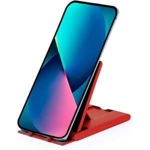 A red phone stand displays a smartphone with a vibrant screen. The holder features an adjustable design for various angles.