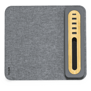 A grey mousepad with a bamboo accent and built-in device charging ports. Features a sleek design and branded logo.