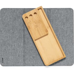 A grey mousepad features a bamboo tray with three holes, designed for multifunctional use.