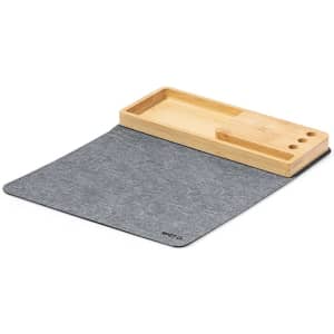 A grey multifunction mousepad with a natural wooden tray for accessories. It features several slots for organising items.