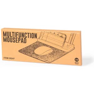 A multifunction mousepad in a cardboard box displaying a simple design. The mousepad is grey with a wireless charging feature.