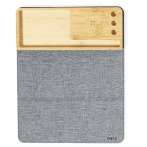 A multifunction mousepad featuring a bamboo section and a grey fabric surface, with cutouts for organisation.