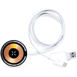 A wireless charger with a round, black and copper design, featuring a white USB cable. It includes a connector for charging.