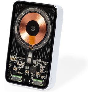 A power bank with a sleek black and white design, featuring visible internal circuitry and a copper coil for wireless charging.