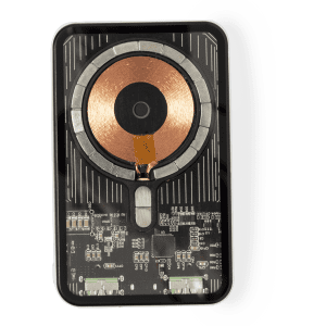 A black power bank with a circular copper charging pad and circuit components visible underneath.