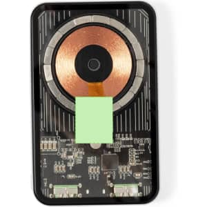 A black power bank featuring a copper coil and electronic components, designed for wireless charging.