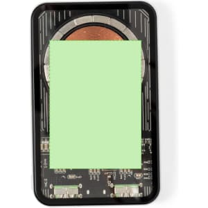 A power bank with a sleek black design, featuring a circular charging pad and exposed electronic components.