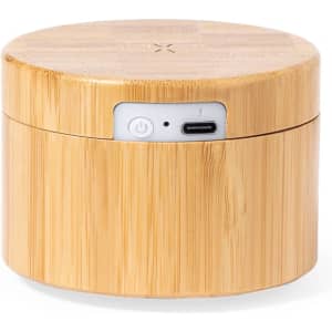 A round, bamboo wireless charger with a power button and USB-C port, featuring a smooth, natural finish.