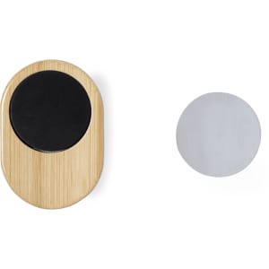A bamboo phone holder in a natural finish with a black circular grip and a separate silver disc for mounting.
