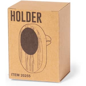 A brown cardboard box containing a circular phone holder with a textured design. The box has a logo.