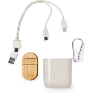 A beige charging cable with multiple connectors, a cream case, a wooden accessory, and a metal carabiner.