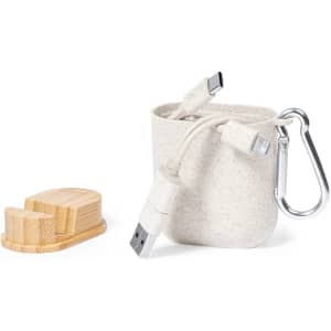 A grey Brayce charging cable bundled in a felt pouch, accompanied by a wooden stand and a metal carabiner.