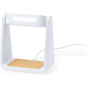 A white multifunction alarm clock with a bamboo charging pad and integrated light, featuring a logo on the front.