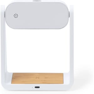 A white multifunction alarm clock with a wooden base and a speaker, featuring a sleek, modern design.