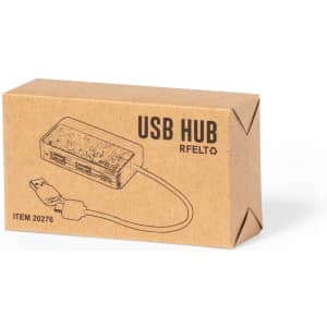 A brown cardboard box containing a USB hub with multiple ports and an attached cable. The box features a logo.