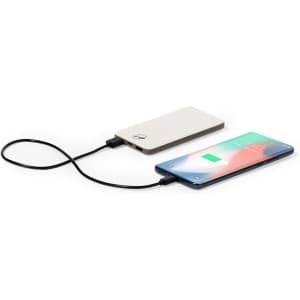 A power bank in a sleek design, connecting to a smartphone via a charging cable. The power bank is mostly white.