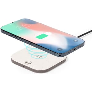 A wireless charger in white with a phone hovering above it, featuring a logo on the charger.
