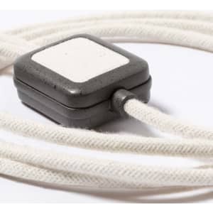 A charging cable with a textured white and grey connector, featuring a fabric-wrapped cord. It has a branding logo.