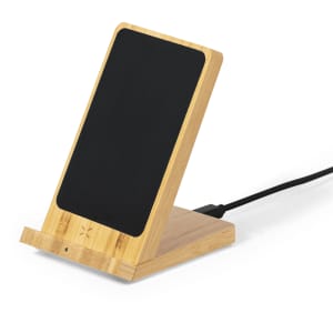 A wireless charger on a bamboo stand featuring a black charging surface and a connected power cable.