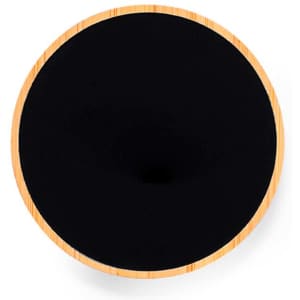 A circular wireless charger with a black surface and a bamboo edge, featuring a logo.