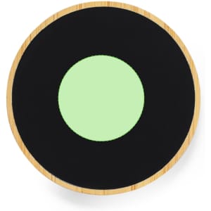 A round wireless charger with a black surface and a green centre, framed by a natural bamboo border.
