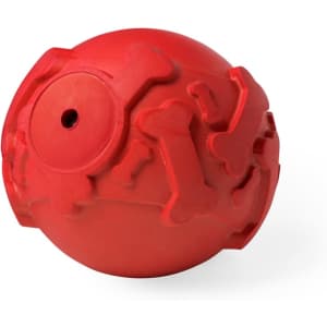 A red rubber ball designed with bone shapes for pets, featuring a small hole and a textured surface.