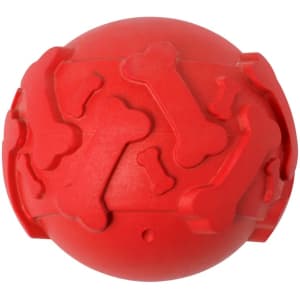A red rubber ball featuring bone patterns, designed as a pet accessory for home use. It has a logo visible on the surface.