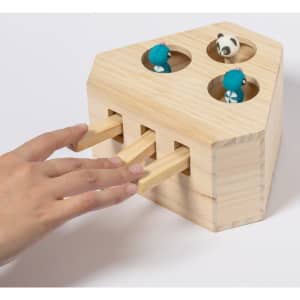 A wooden pet-themed game with three holes, featuring playful figures and sliding wooden levers in a natural finish.