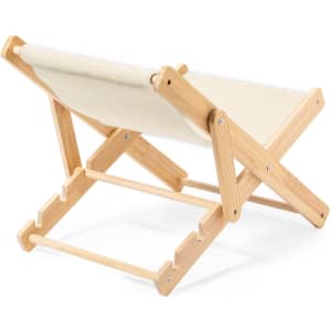 A lightweight wooden chair with a beige fabric seat, featuring a foldable design and natural wood finish.