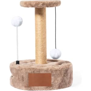 A beige cat scratching post with a soft base, featuring two hanging pom-poms for play. It has a branding area.