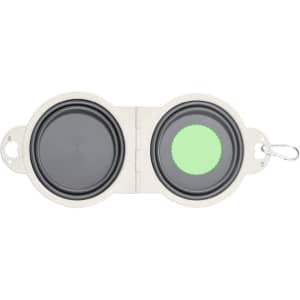A foldable bowl with a grey interior and a green base, featuring a clip for easy attachment. Contains a logo.
