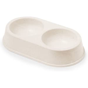 A beige pet food bowl with two circular compartments, made from eco-friendly material. It features a simple design.