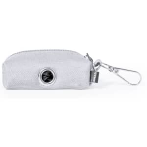 A grey waste bag dispenser with a clip for easy attachment, featuring a circular opening for easy access.