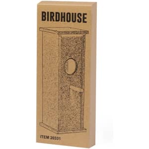 A birdhouse in a rectangular cardboard packaging with an illustration and a circular entrance hole.