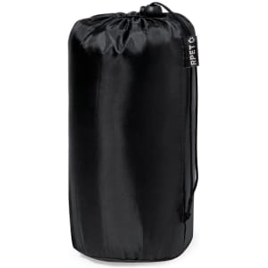A sleek black blanket stored in a cylindrical bag with a drawstring closure and a branding label.