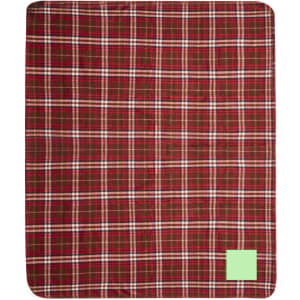 A red and green plaid blanket featuring a branding logo in one corner.