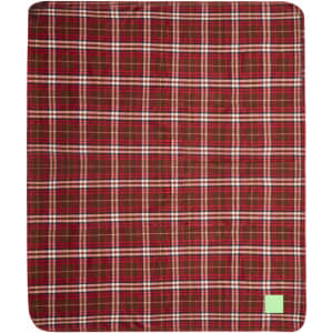 A red and white plaid blanket featuring a green logo in one corner.