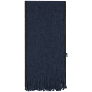 A navy blue scarf with fringe detailing and a branded label on the side.