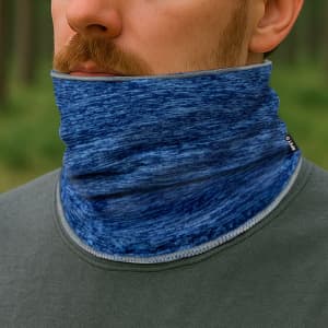 A blue neck warmer made of soft material, worn around a person's neck, featuring a discreet logo.
