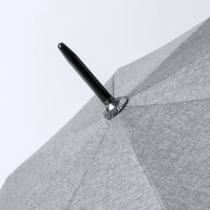 A grey umbrella with a black handle, featuring a simple design and a metal tip at the top.